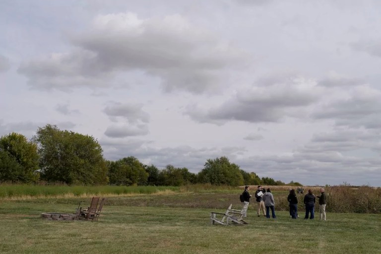 Congressman Eric Sorensen, right, talks with Rock Island County farmers and Illinois Farm Bureau leaders at a family farm in Taylor Ridge, Illinois, Monday, Oct. 14, 2024. He discussed the status of the farm bill, the effects of severe weather on farms, and Sorensen's efforts on behalf of Illinois producers.