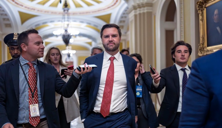 Vice President-elect J.D. Vance leaves the Senate chamber as lawmakers work on an interim spending bill to avoid a shutdown of federal agencies at the Capitol in Washington, Wednesday, Dec. 18, 2024.