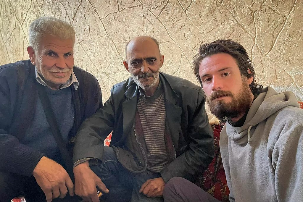American released from Syrian prison is flown out of the country, a US official says