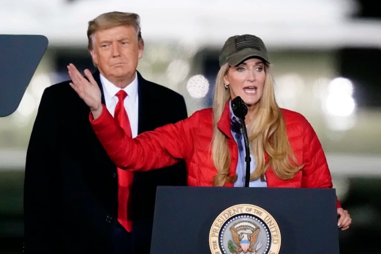Then-Sen. Kelly Loeffler (R-GA) speaks as then-President Donald Trump listens during a campaign rally in support of Senate candidates in Dalton, Georgia on Jan. 4, 2021.
