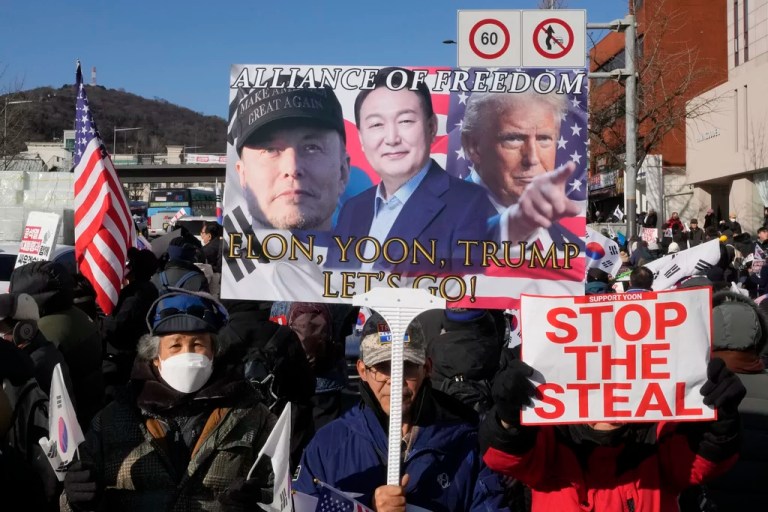 Supporters of impeached South Korean President Yoon Suk Yeol attend with a banner showing portraits of him, center, President Donald Trump and Tesla and SpaceX CEO Elon Musk, left, during a rally to oppose his impeachment near the presidential residence in Seoul, South Korea, Friday, Jan. 10, 2025.