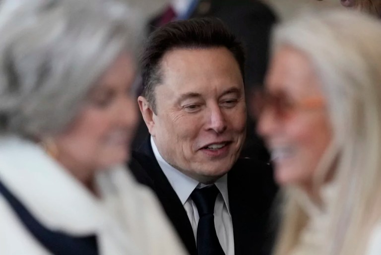 Elon Musk arrives before the 60th Presidential Inauguration in the Rotunda of the U.S. Capitol in Washington, Monday, Jan. 20, 2025. In foreground are Susie Wiles, left and Miriam Adelson.