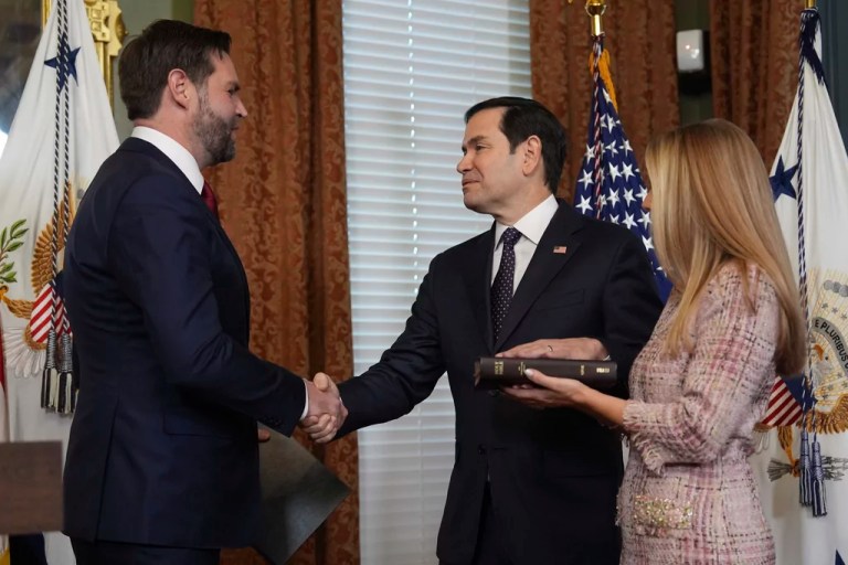 Secretary of State Marco Rubio shakes hands with Vice President JD Vance after being sworn in Tuesday, Jan. 21, 2025, in the Vice Presidential Ceremonial Office in the Eisenhower Executive Office Building on the White House campus in Washington, as his wife, Jeanette Rubio, looks on. (AP Photo/Evan Vucci)