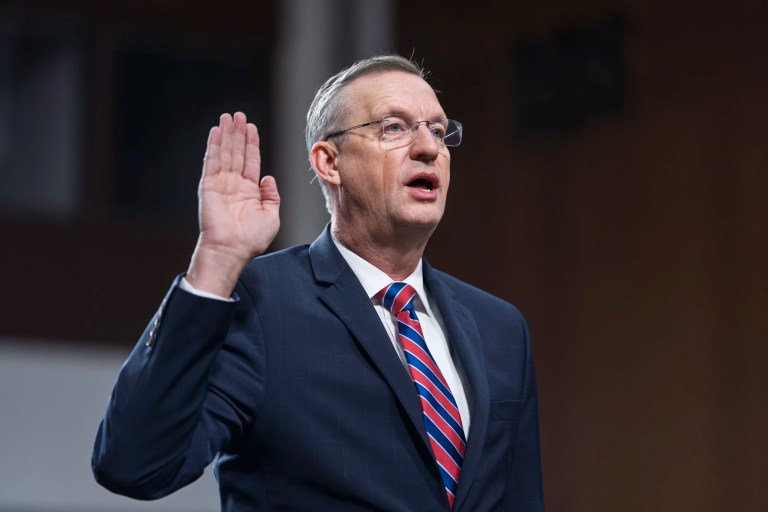 Doug Collins, President Donald Trump's pick for secretary of the Department of Veterans Affairs, is sworn-in to testify at his confirmation hearing before the Senate Veterans Affairs Committee at the Capitol in Washington, Tuesday, Jan. 21, 2025.