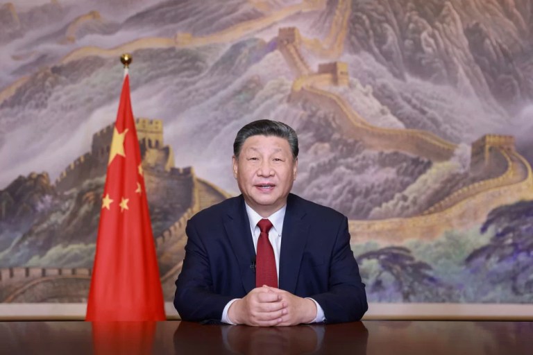 In this photo released by Xinhua News Agency, Chinese President Xi Jinping delivers a New Year message on Tuesday, Dec. 31, 2024 in Beijing to ring in 2025.