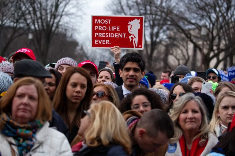 In this Jan. 24, 2020, file photo, supporters listen as President Donald Trump speaks during the annual 