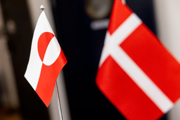 The flag of Greenland, left, and the flag of Denmark, right, are pictured during a meeting of Denmark's Finance Minister Nicolai Wammen and the Greenlandic Minister for Finances and Taxes Erik Jensen in Copenhagen, Denmark, Wednesday, Jan. 8, 2025.