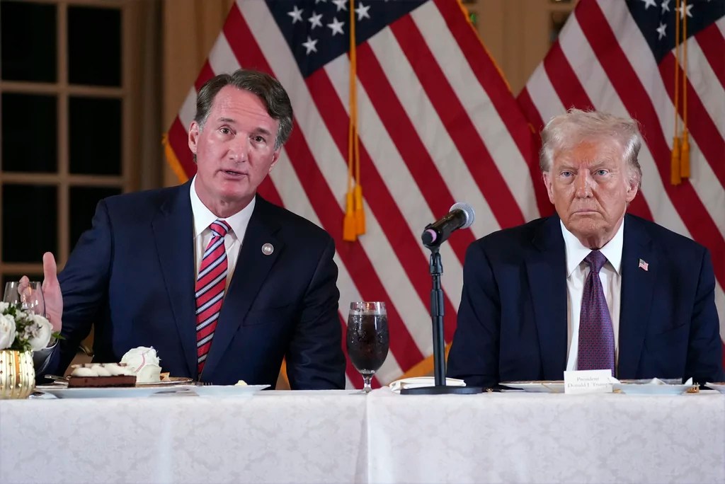 President-elect Donald Trump listens as Virginia Gov. Glenn Youngkin speaks during a meeting with Republican governors at Mar-a-Lago, Thursday, Jan. 9, 2025, in Palm Beach, Fla. 