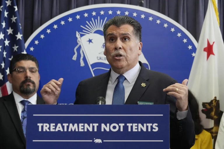 Los Angeles County Sheriff Robert Luna speaks at a podium.