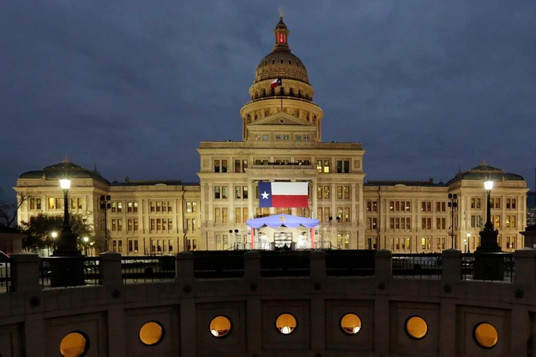 A large Texas flag hangs from the Texas State Capitol in Austin, Texas, on Jan. 14, 2019.
