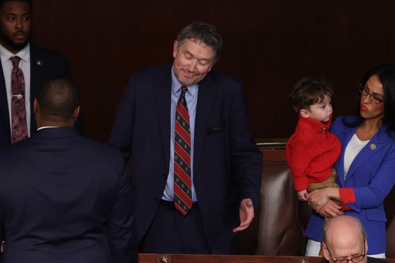 Representative Thomas Massie, a Republican from Kentucky, speaks to colleagues in the House Chamber of the U.S. Capitol in Washington, D.C., on Friday, Jan. 3, 2025. Rep. Lauren Boebert (R-CO) holds her grandchild Tyler on his right.