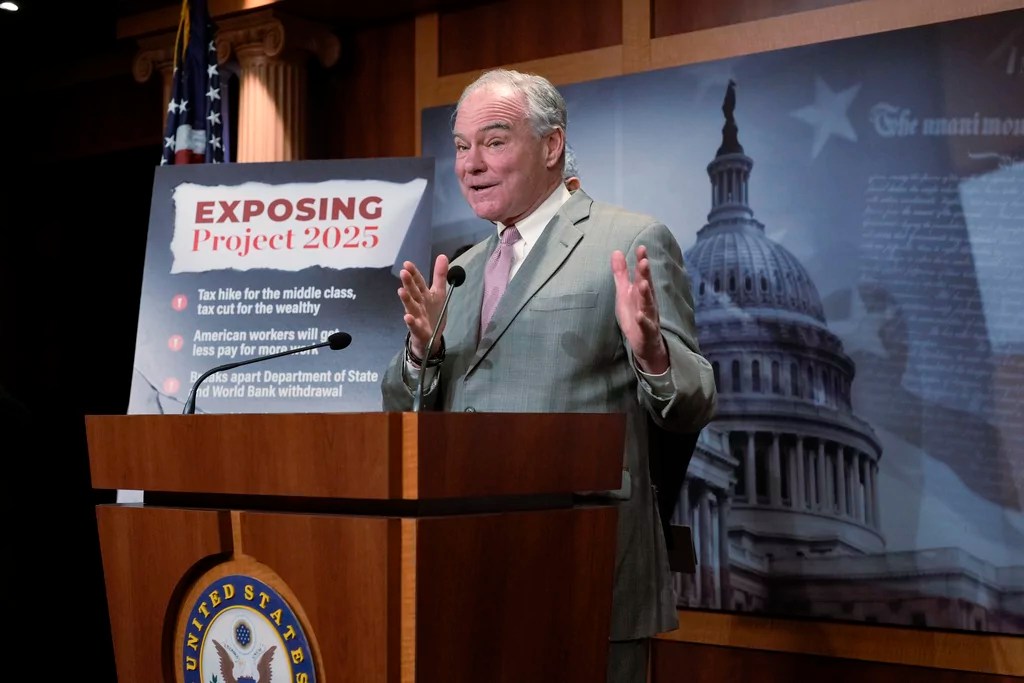Sen. Tim Kaine, D-Va., a member of the Senate Budget Committee, criticizes Russ Vought, an author of the conservative handbook Project 2025 and President Donald Trump's pick to run the Office of Management and Budget, at a news conference at the Capitol in Washington, Thursday, Jan. 23, 2025.
