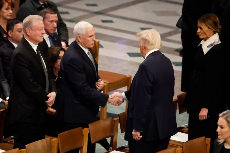 Trump shakes hands with Pence and chats with Obama at Carter funeral