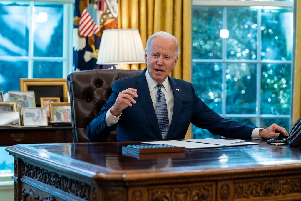 Biden defends record in raspy-voiced final interview