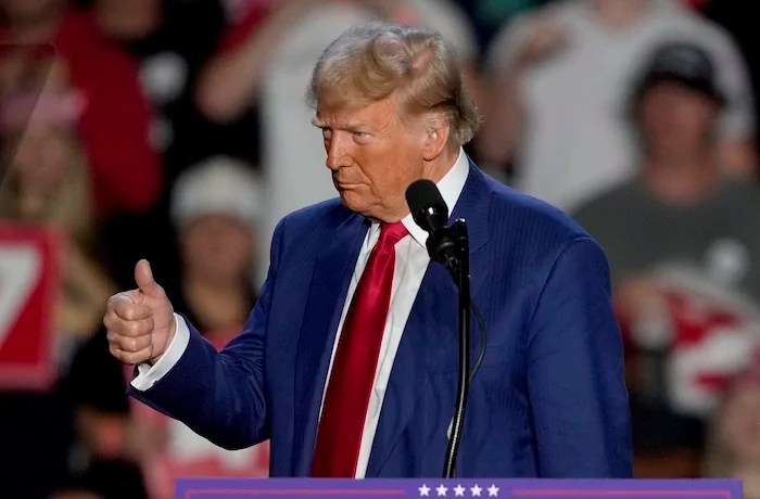 Republican presidential nominee former President Donald Trump gives a thumbs up as he speaks at a campaign event at Mullett Arena, Thursday, Oct. 24, 2024, in Tempe, Ariz.