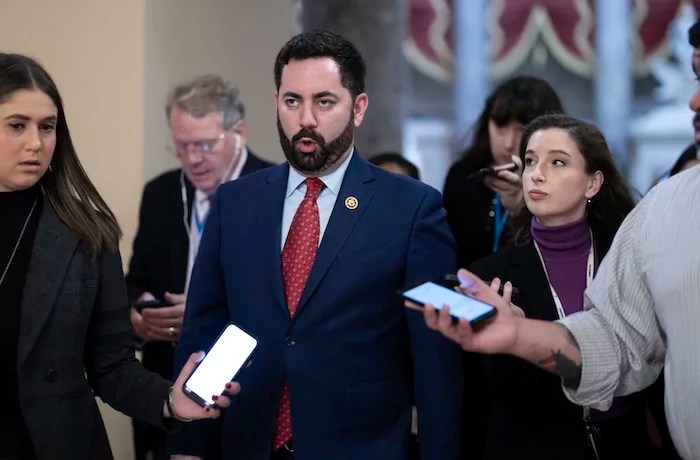 Rep. Mike Lawler, R-N.Y., walks with reporters on his way to the chamber for final votes of the week, at the Capitol in Washington, Friday, Jan. 12, 2024.