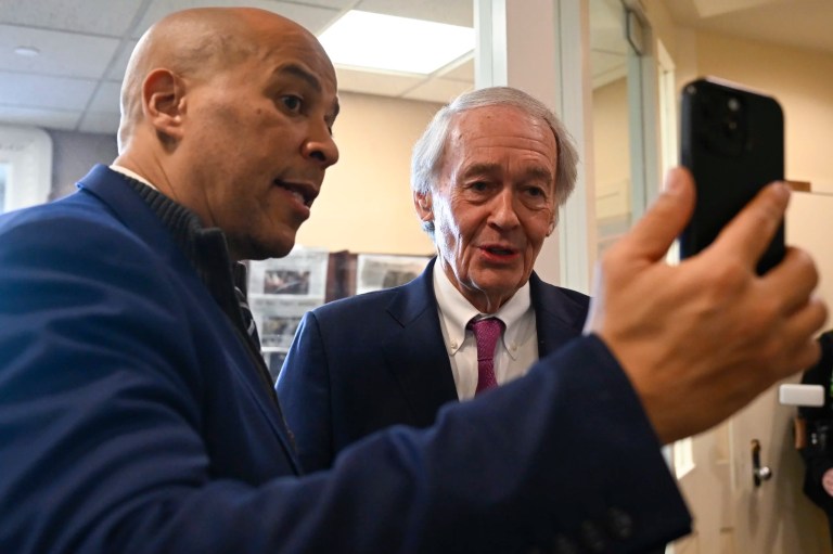Sen. Cory Booker (D-NJ) and Sen. Ed Markey (D-MA) make a TikTok video after a press conference they held to discuss Markey's bill to delay the TikTok ban deadline at the Capitol in Washington, Thursday, Jan. 16, 2025.