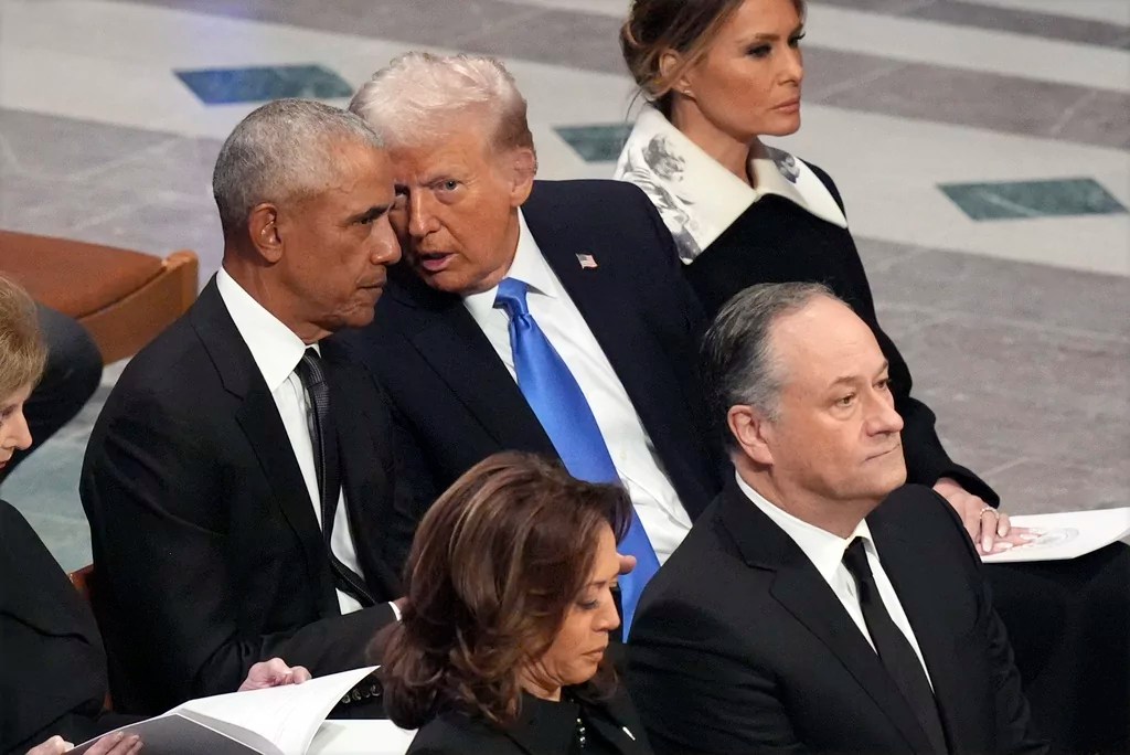 Former President Barack Obama talks with President-elect Donald Trump as Melania Trump listens and as Vice President Kamala Harris and second gentleman Doug Emhoff arrive, before the state funeral for former President Jimmy Carter at Washington National Cathedral in Washington, Thursday, Jan. 9, 2025. 