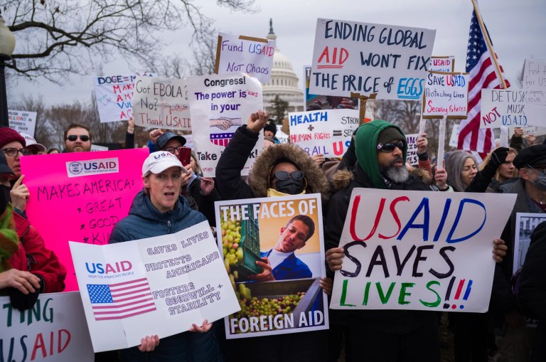 Hundreds of people gathered near the Capitol to protest the dismantling of USAID, the international agency charged with dispensing humanitarian aid around the world on behalf of the United States.
