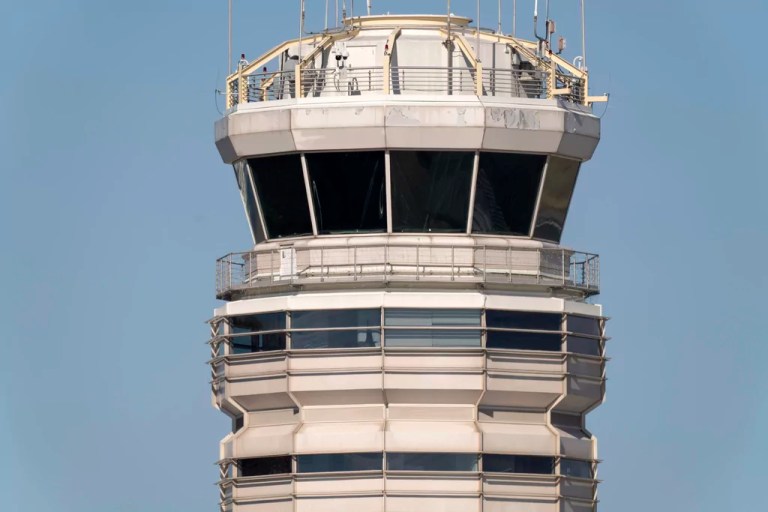 The air traffic control tower at Ronald Reagan Washington National Airport is pictured, Saturday, Feb. 1, 2025, in Arlington, Virginia, near the wreckage of a mid-air collision between a Black Hawk helicopter and an American Airlines jet in the Potomac River.
