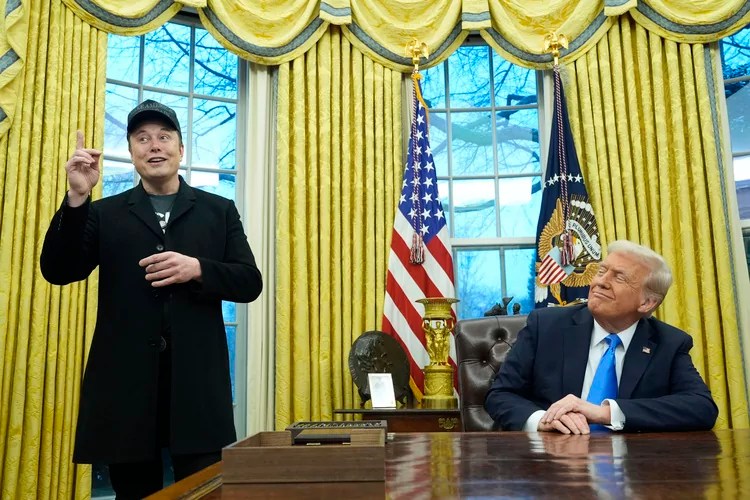 Elon Musk, joined by his son X Æ A-Xii, speaks in the Oval Office at the White House, Tuesday, Feb. 11, 2025, in Washington, during an event with President Donald Trump. (AP Photo/Alex Brandon)
