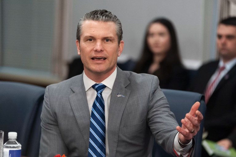 Defense Secretary Pete Hegseth, second from right, and Border czar Tom Homan, left, listen to a briefing by Army soldiers while visiting the US-Mexico border in Sunland Park,, N.M., Monday, Feb. 3, 2025.