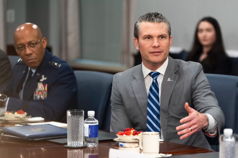 Secretary of Defense Pete Hegseth, with Gen. CQ Brown, chairman of the Joint Chiefs of Staff, left, responds to reporters' questions before the start of a meeting with Israeli Prime Minister Benjamin Netanyahu at the Pentagon, Wednesday, Feb. 5, 2025, in Washington.