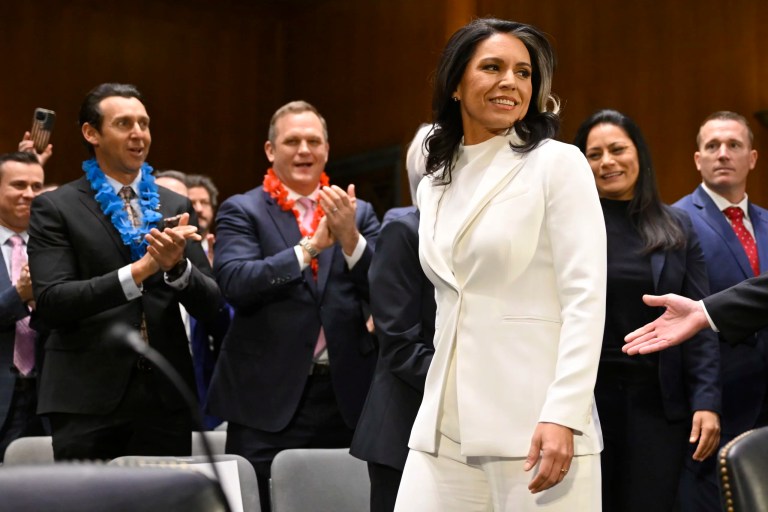 Director of National Intelligence Tulsi Gabbard is greeted by well wishers seated in the front row before her appearance with the Senate Intelligence Committee for her confirmation hearing at the U.S. Capitol, Thursday, Jan. 30, 2025, in Washington.