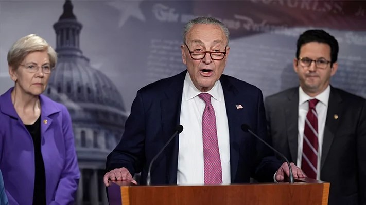 Senate Minority Leader Chuck Schumer (D-NY), center, flanked by Sen. Elizabeth Warren (D-MA), left, and Sen. Brian Schatz (D-HI), speaks about the Department of Government Efficiency during a news conference at the Capitol in Washington on Feb. 3, 2025.