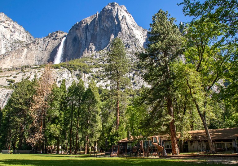 In this May 27, 2020, file photo provided by the National Park Service, Yosemite Valley School, lower right, stands in Yosemite National Park, California. In the background is Upper Yosemite Falls.