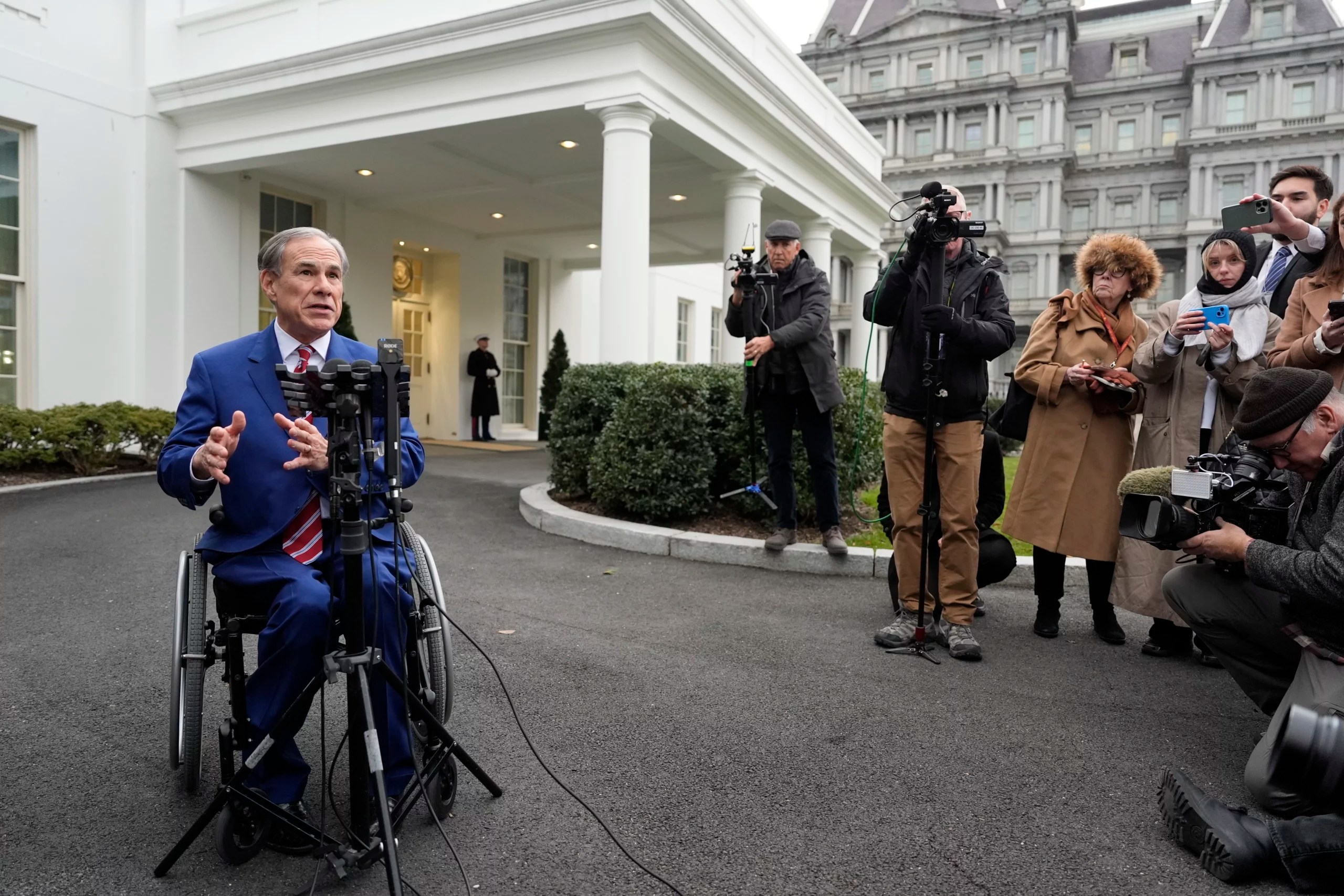 Gov. Greg Abbott (R-TX) speaks to reporters outside the West Wing of the White House, Wednesday, Feb. 5, 2025, in Washington.