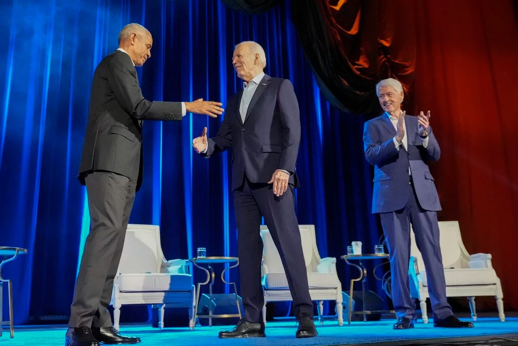 President Joe Biden, center, and former presidents Barack Obama, left, and Bill Clinton, right, participate in a fundraising event at Radio City Music Hall, Thursday, March 28, 2024, in New York. (AP Photo/Alex Brandon)