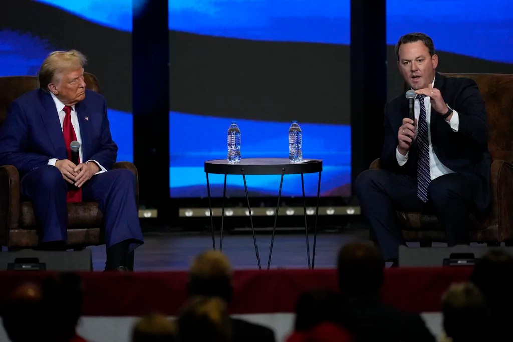 Republican presidential nominee former President Donald Trump listens during a faith town hall with Georgia Lt. Gov. Burt Jones at Christ Chapel Zebulon, Wednesday, Oct. 23, 2024, in Zebulon, Ga. (AP Photo/Julia Demaree Nikhinson)