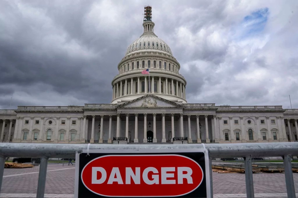 A security fence warns visitors away from a construction area at the Capitol in Washington, Monday, Sept. 25, 2023.