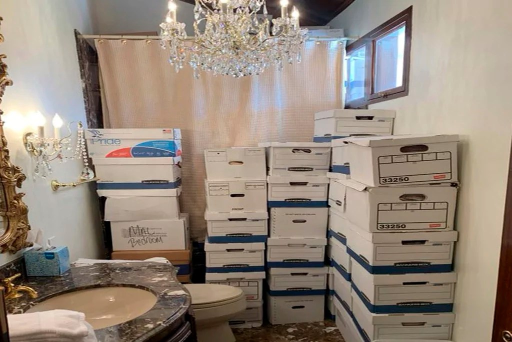 This image, contained in the indictment against former President Donald Trump, shows boxes of records stored in a bathroom and shower in the Lake Room at Trump's Mar-a-Lago estate in Palm Beach, Fla. The classified documents investigation of Donald Trump appeared to have clear momentum in 2022 when FBI agents who searched the former president’s Mar-a-Lago estate recovered dozens of boxes containing sensitive documents. But each passing day brings mounting doubts that the case can reach trial this year. The judge has yet to set a firm trial date despite holding two hours-long hearings with lawyers this month. (Justice Department via AP)