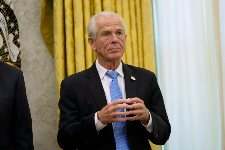 White House senior counselor for trade and manufacturing Peter Navarro listens as President Donald Trump speaks to reporters after signing an executive order in the Oval Office of the White House, Thursday, Feb. 13, 2025, in Washington.
