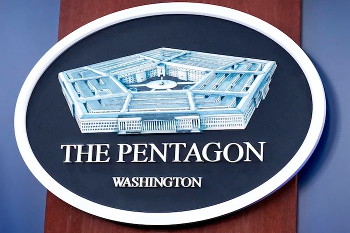 The Department of Defense logo is seen on the wall in the press briefing room at the Pentagon, Oct. 29, 2024, in Washington.