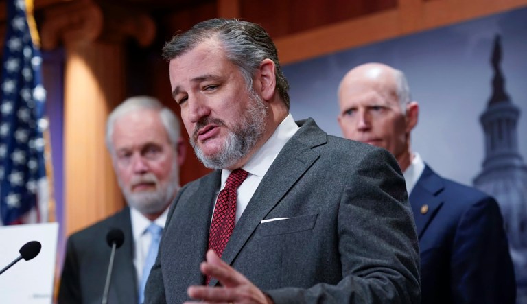 Sen. Ted Cruz (R-TX), center, flanked by Sens. Ron Johnson (R-WI), left, and Rick Scott (R-FL), speaks to reporters as the lawmakers criticize the current border security bill being negotiated, during a news conference at the Capitol in Washington, Wednesday, Jan. 24, 2024.