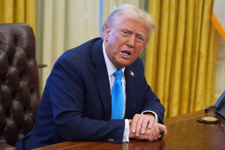 President Donald Trump speaks to reporters as he signs executive orders in the Oval Office of the White House, Tuesday, Feb. 4, 2025, in Washington.