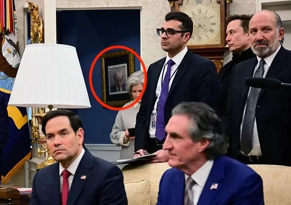 Trump’s mug shot seen hanging up in a gold frame outside the Oval Office
