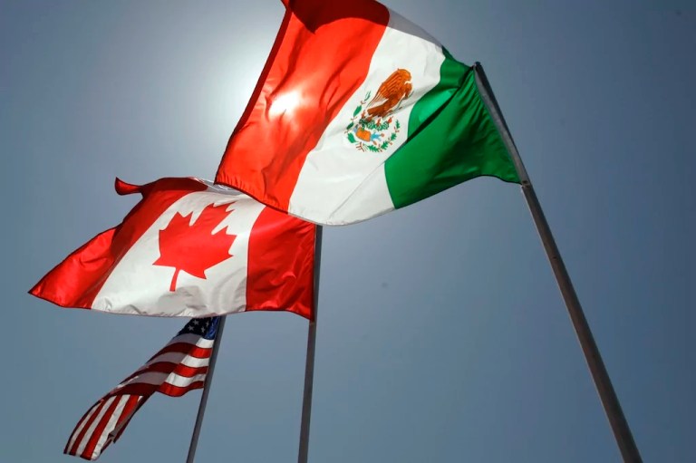 National flags representing the United States, Canada, and Mexico fly in the breeze in New Orleans where leaders of the North American Free Trade Agreement met, April 21, 2008.