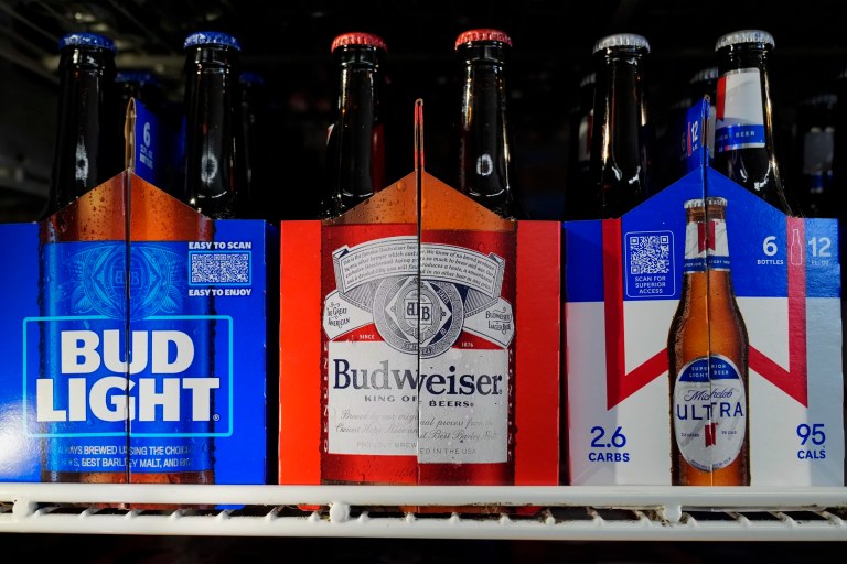Six-packs of Bud Light, Budweiser and Michelob Ultra are displayed at a liquor store, Wednesday, Feb. 28, 2024, in Fairfield, California.