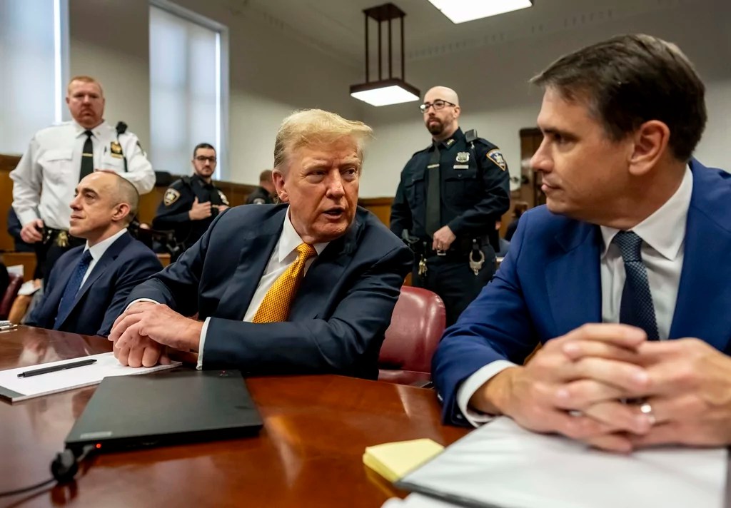 Former President Donald Trump, center, sits in Manhattan Criminal Court with his attorneys Emil Bove, left, and Todd Blanche, Tuesday, May 21, 2024 in New York. (Mark Peterson/Pool Photo via AP)