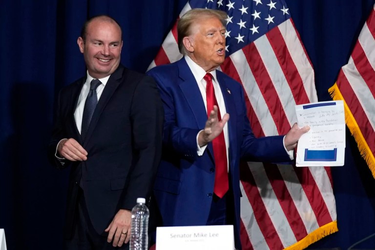 Republican presidential nominee former President Donald Trump participates in a roundtable talks after a roundtable with faith leaders as Sen. Mike Lee, R-Utah, smiles Sunday, Oct. 13, 2024, in Prescott Valley. Ariz. (AP Photo/Evan Vucci)