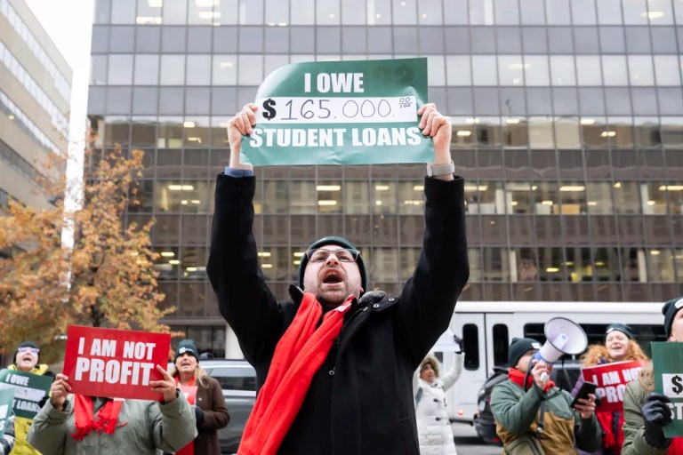 Debt Collective student loan borrowers lead chants in protest outside of the Department of Education urging the administration in their last few weeks to eliminate crushing debt