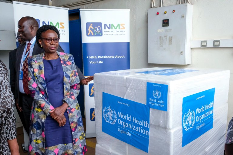 Uganda's Minister of Health Jane Ruth Aceng receives boxes containing one of three candidate vaccines against the Sudan strain of the Ebola virus, in Entebbe, Uganda, Dec. 8, 2022.
