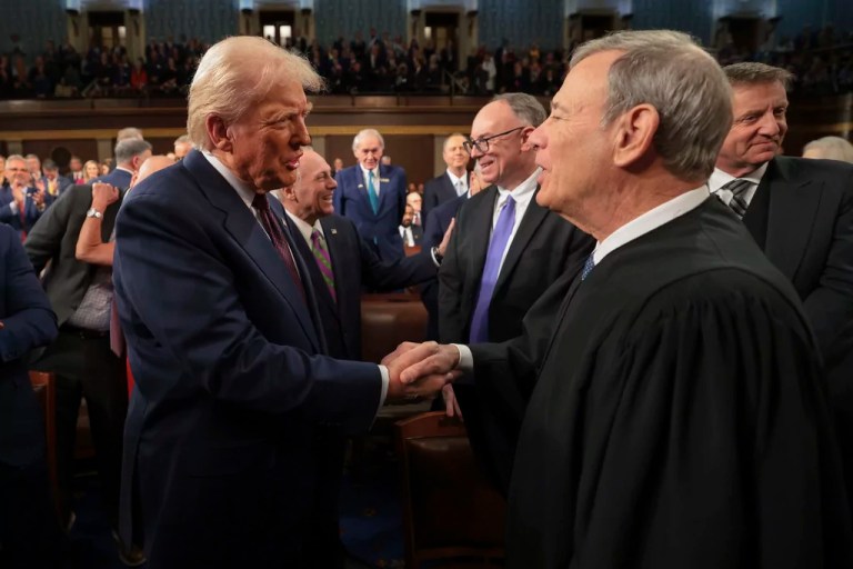 President Donald Trump, left, greets Chief Justice of the Supreme Court John Roberts, right, as he arrives to address a joint session of Congress at the Capitol in Washington, Tuesday, March 4, 2025.