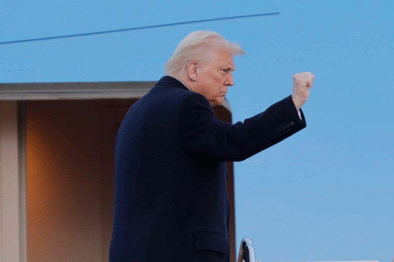 President Donald Trump gestures from the stairs of Air Force One at Joint Base Andrews, Maryland, Friday, March 7, 2025.