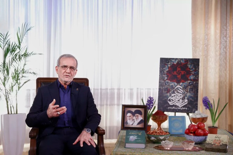 In this photo released by the Iranian Presidency Office, President Masoud Pezeshkian addresses the nation in a televised speech marking the Iranian New Year, called Nowruz, in Tehran, Iran, Thursday, March 20, 2025.