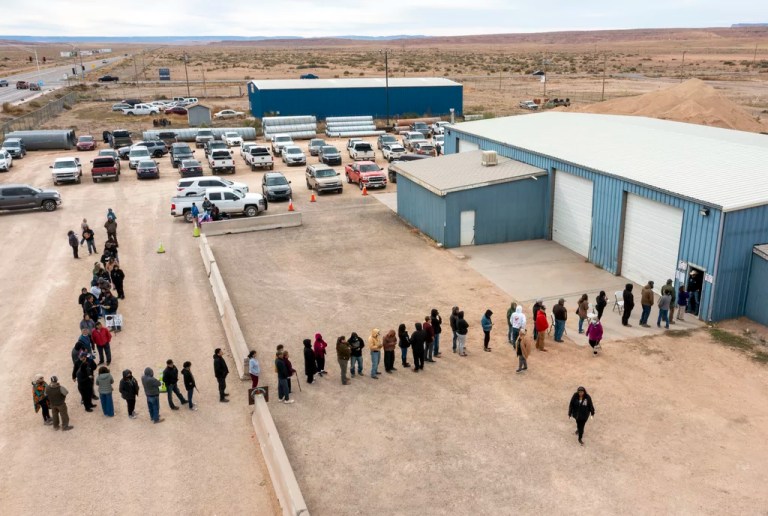 Voters wait in line to cast their ballots outside a polling station on the Navajo Nation in Chinle, Arizona, on Election Day, Tuesday, Nov. 5, 2024.
